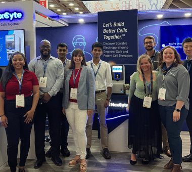 The MaxCyte team standing in front of the MaxCyte booth at the 2024 ASGCT annual meeting